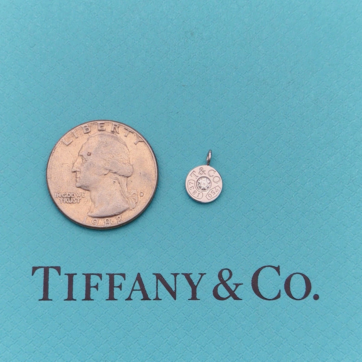 RARE Tiffany & Co. 1837 Circle Mini Pendant with 0.07 CT Diamond Center