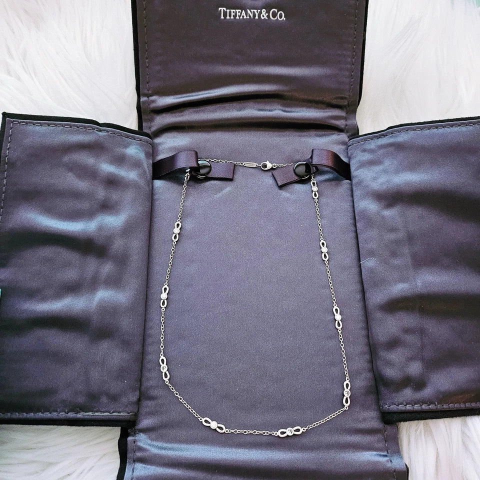 $6,000 Tiffany & Co. Bow Winged Station 0.7 CTW Diamond 18k White Gold Necklace
