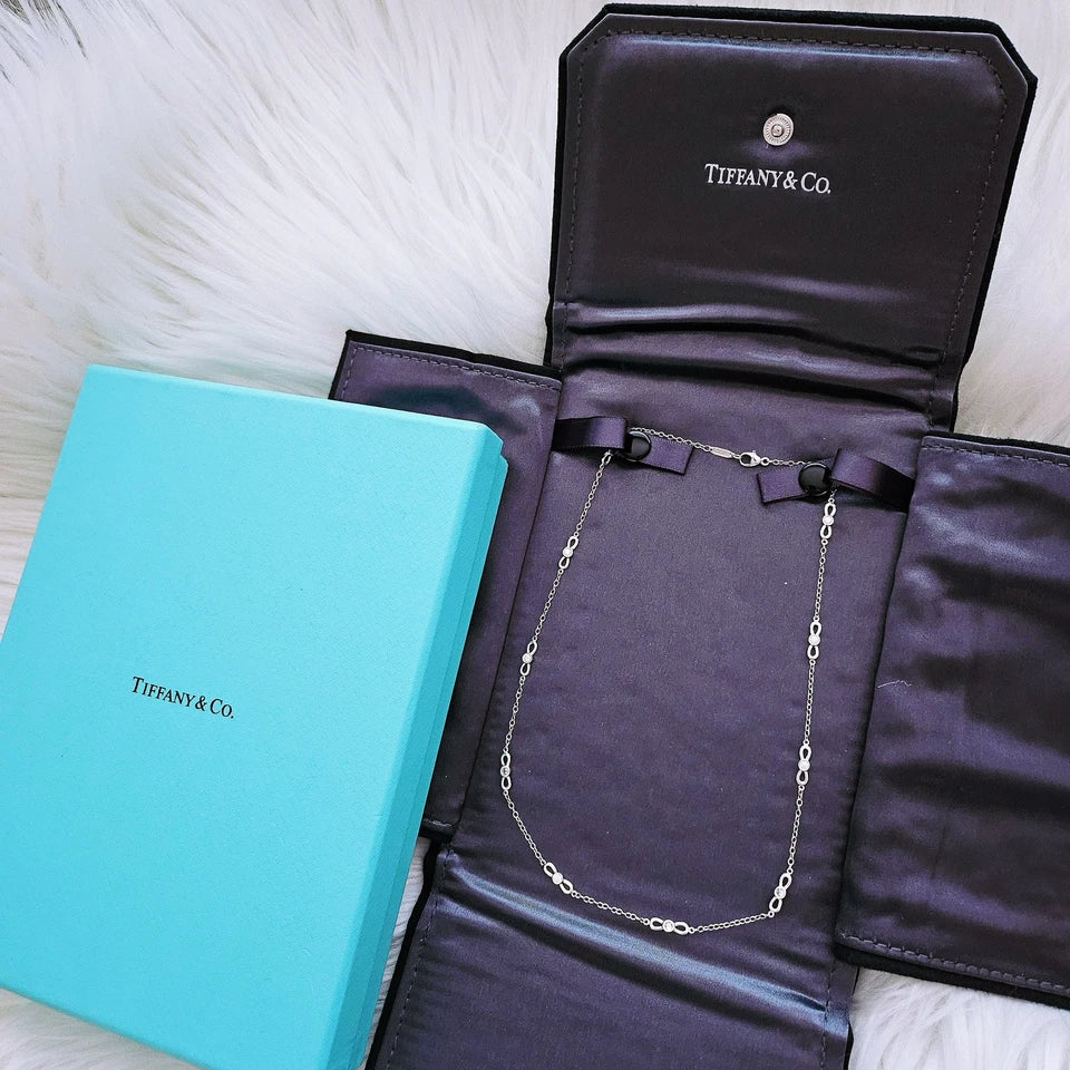 $6,000 Tiffany & Co. Bow Winged Station 0.7 CTW Diamond 18k White Gold Necklace