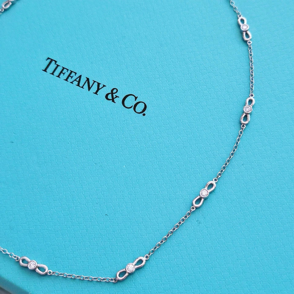 $6,000 Tiffany & Co. Bow Winged Station 0.7 CTW Diamond 18k White Gold Necklace