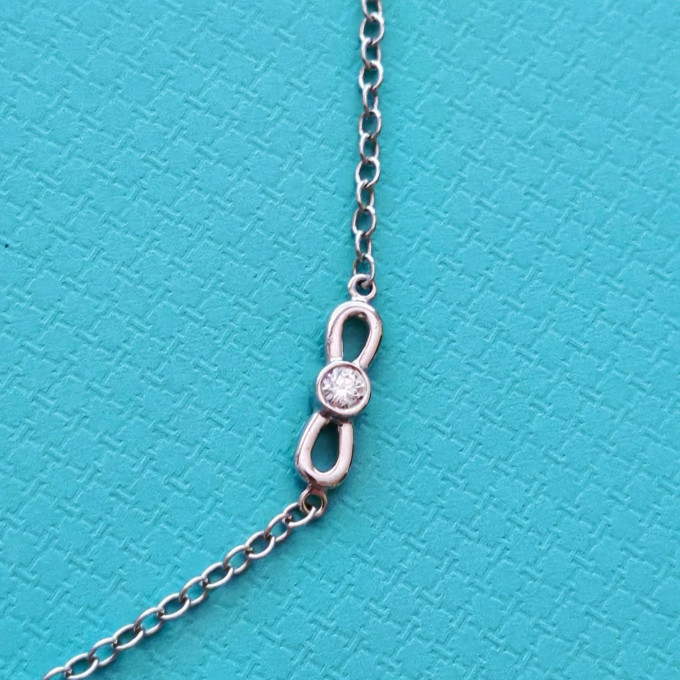 $6,000 Tiffany & Co. Bow Winged Station 0.7 CTW Diamond 18k White Gold Necklace